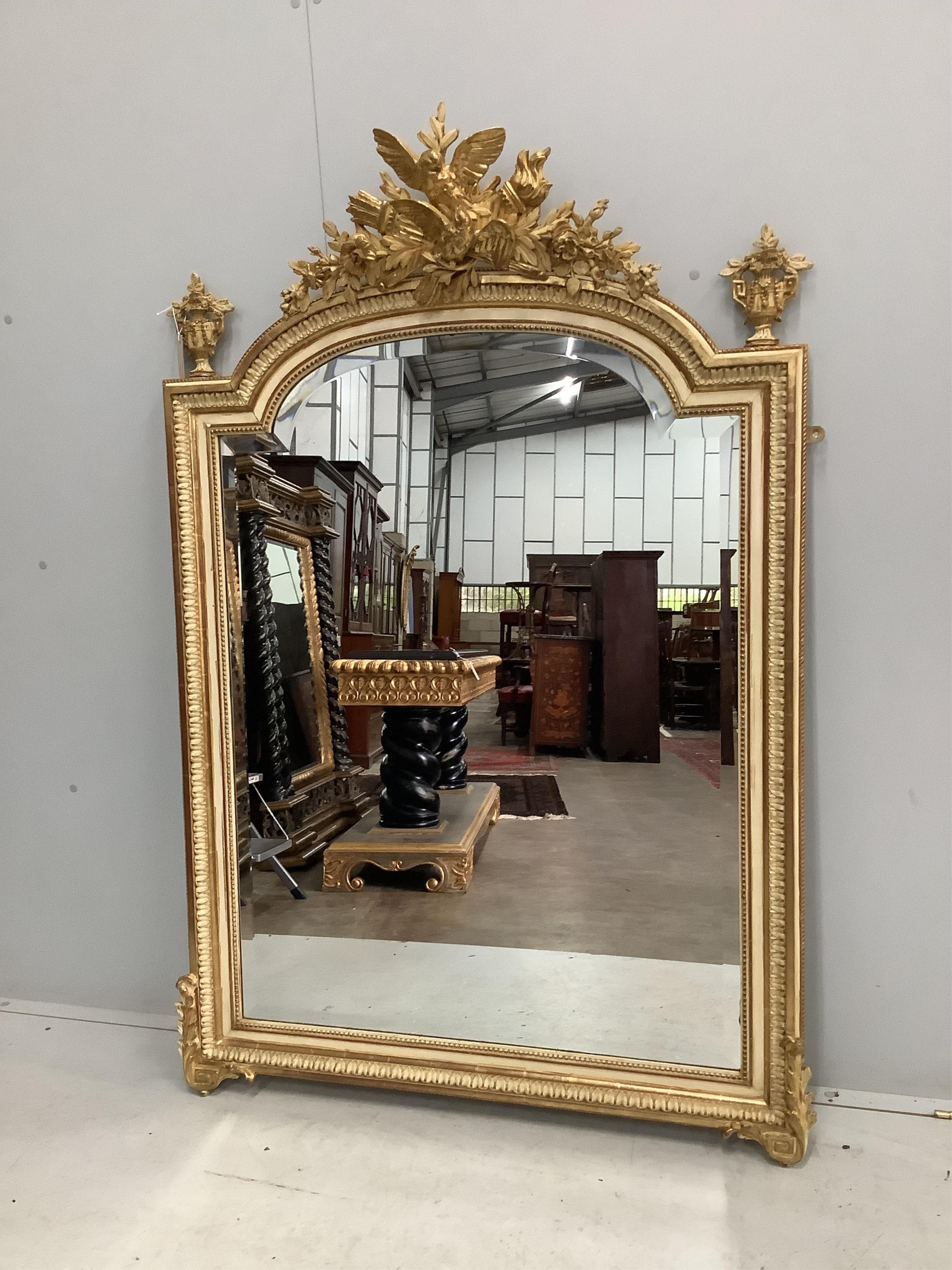 A French parcel gilt cream painted wall mirror, width 108cm, height 160cm. Condition - good